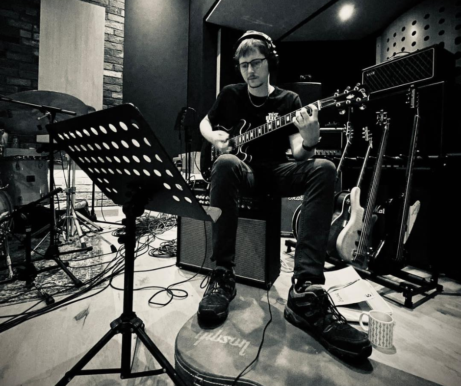 Electric guitarist from That Big Band practicing music