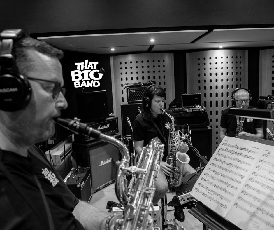 Saxophone players in That Big Band practicing music