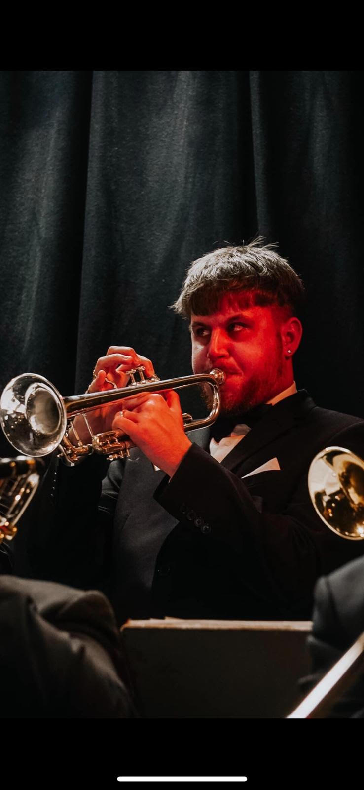 San Rivett playing the trumpet